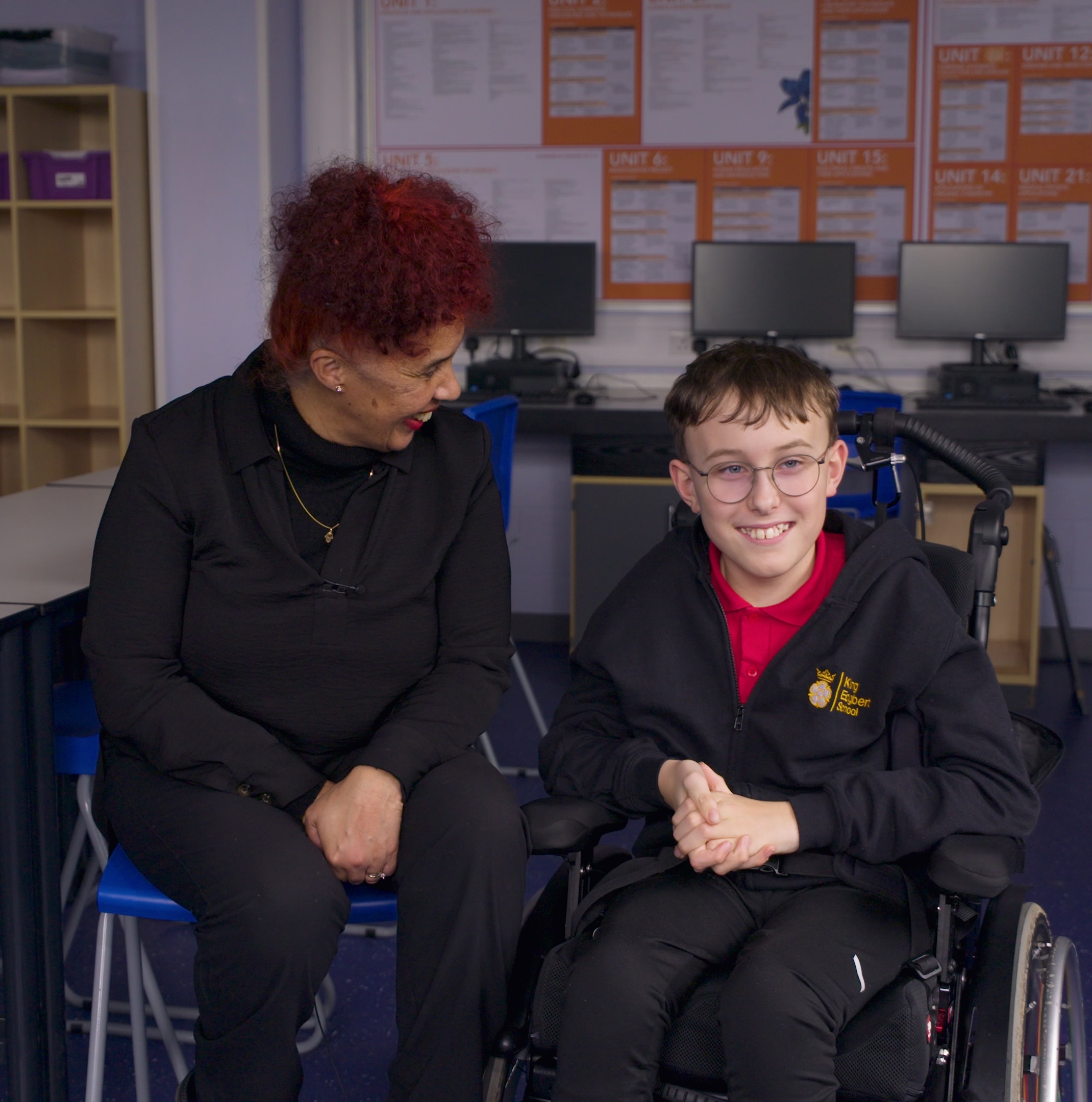 Child in a wheelchair and Learning Support Assistant